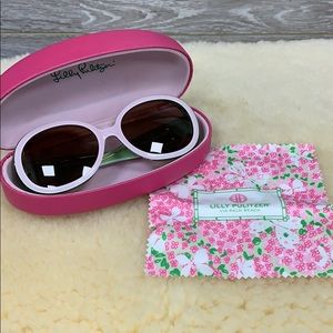 Lilly Pulitzer pale pink and green sunglasses.